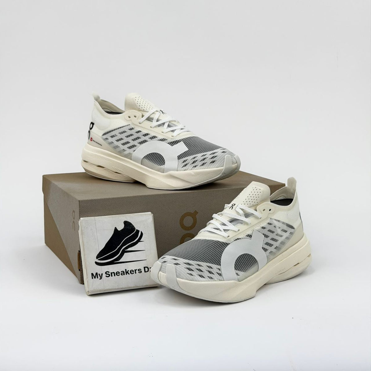 On Cloudboom Strike Triple White